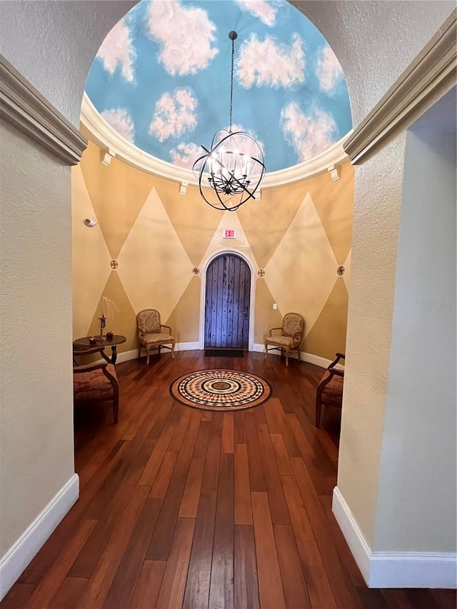 interior space featuring a notable chandelier and hardwood / wood-style flooring