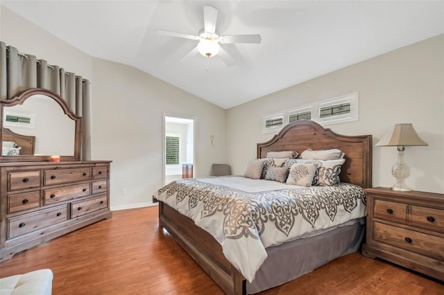 bedroom featuring vaulted ceiling, ceiling fan, and hardwood / wood-style flooring