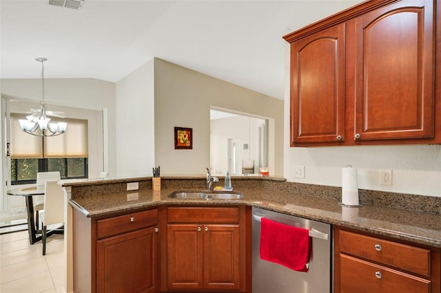 kitchen featuring light tile floors, a notable chandelier, dark stone counters, dishwasher, and sink