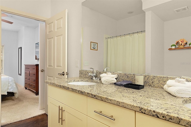 bathroom featuring vanity and ceiling fan