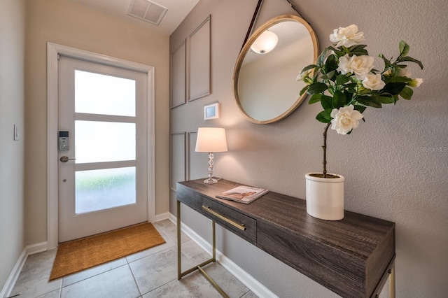 entryway featuring light tile floors