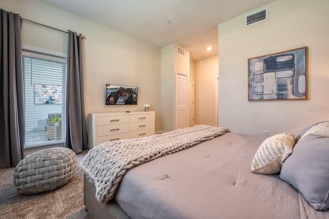 bedroom with carpet floors and a closet