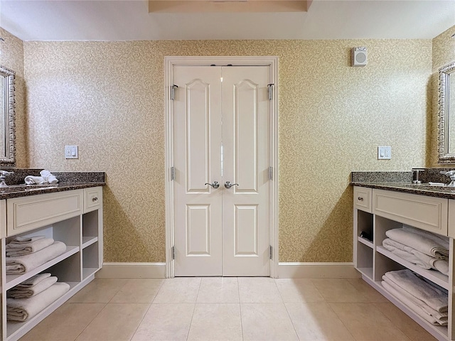 bathroom with tile patterned flooring and vanity