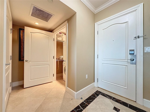 tiled entrance foyer with crown molding