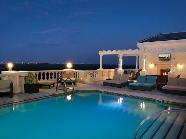 view of swimming pool featuring a pergola, outdoor lounge area, and a patio area