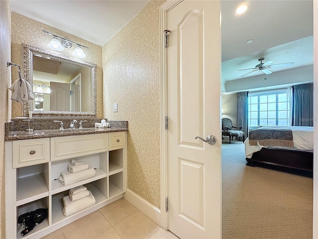 bathroom featuring tile patterned flooring, ceiling fan, and vanity