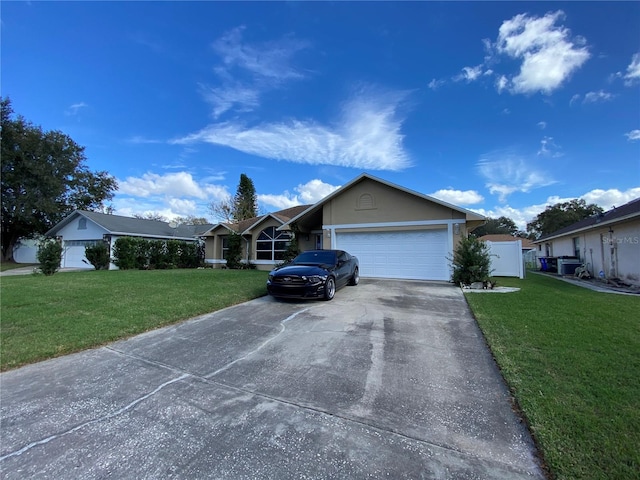 ranch-style house featuring a front lawn and a garage