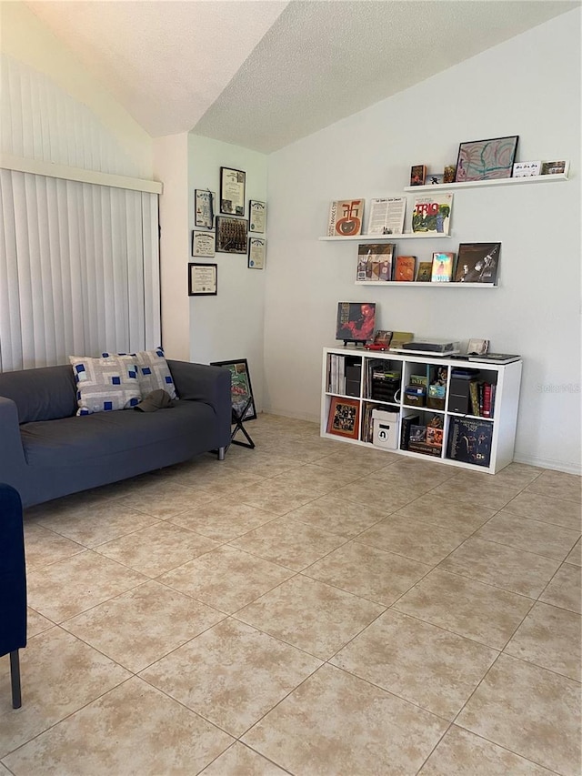 tiled living room with lofted ceiling and a textured ceiling