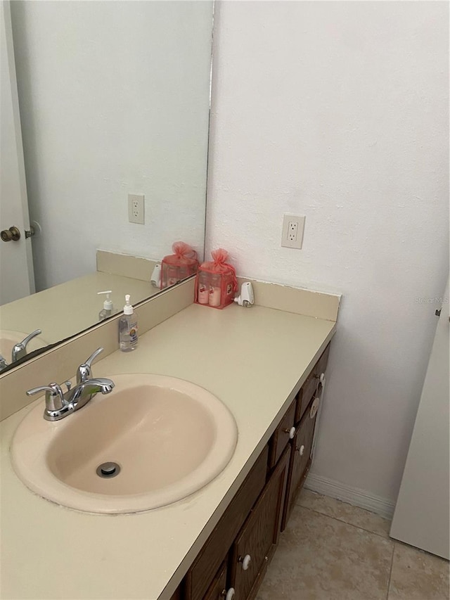 bathroom with oversized vanity and tile floors