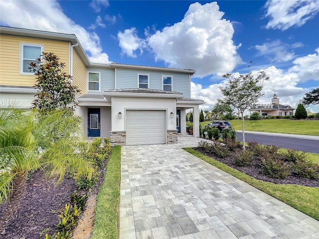 view of front of house with a front lawn and a garage