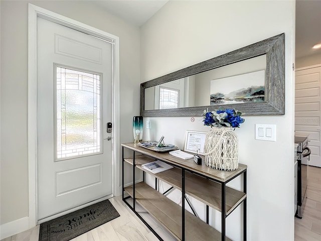 doorway with light hardwood / wood-style flooring