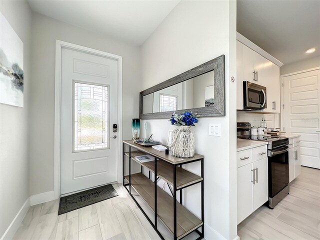 doorway featuring light hardwood / wood-style floors