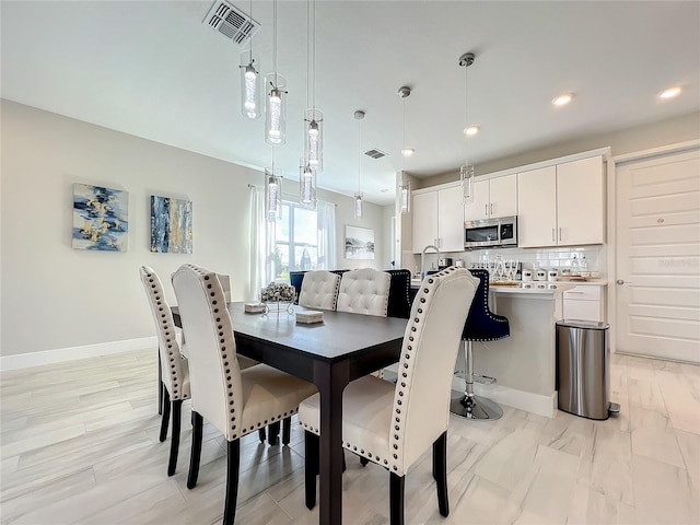 dining space featuring sink