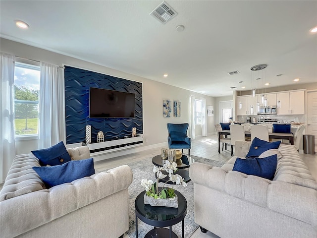 living room with light hardwood / wood-style flooring