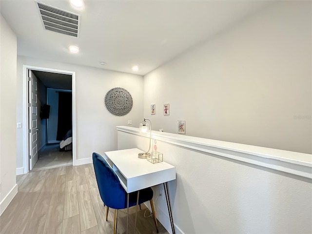 hallway featuring light hardwood / wood-style flooring