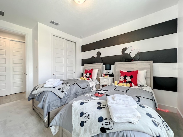 carpeted bedroom featuring a closet