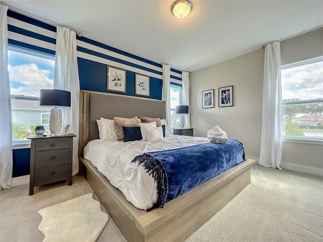 bedroom with light colored carpet