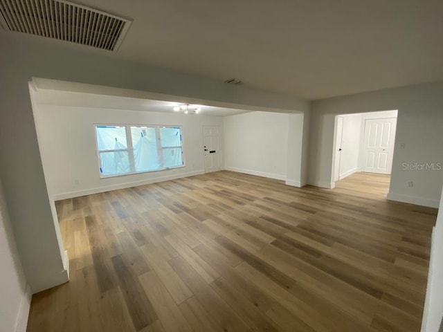 unfurnished living room with hardwood / wood-style flooring