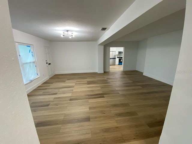 empty room with hardwood / wood-style floors