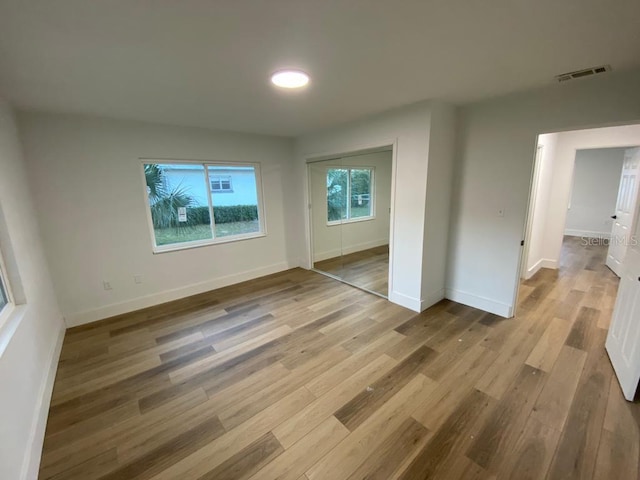 spare room featuring light hardwood / wood-style floors