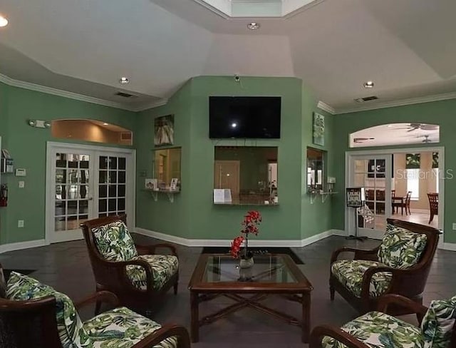 living room featuring french doors, visible vents, crown molding, and baseboards