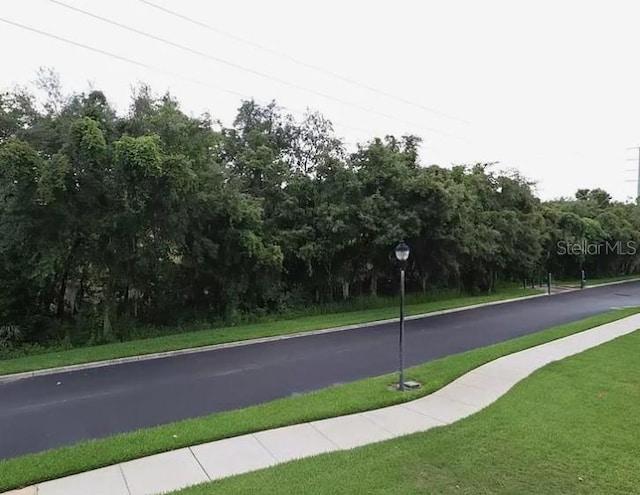 view of road featuring curbs and sidewalks