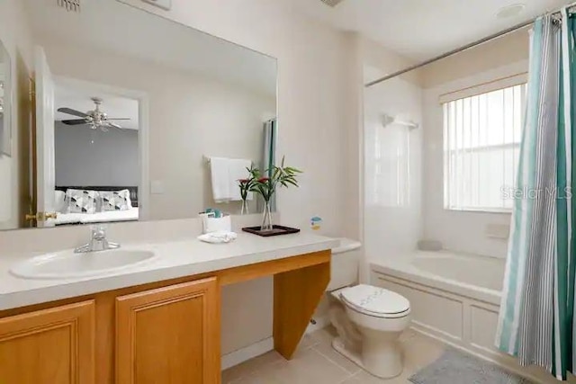 full bathroom with toilet, ceiling fan, vanity with extensive cabinet space, tile floors, and shower / bathtub combination with curtain