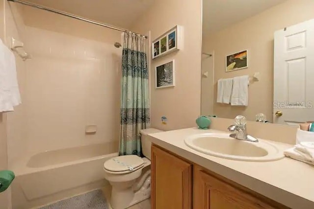 full bathroom with shower / bath combo, toilet, and vanity