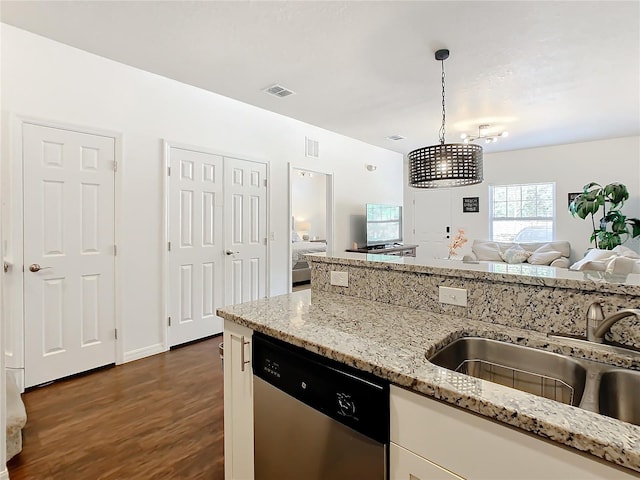 kitchen featuring light stone countertops, hanging light fixtures, a chandelier, dishwasher, and dark hardwood / wood-style flooring