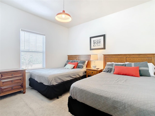 bedroom with light colored carpet