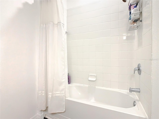 bathroom featuring shower / bath combination with curtain