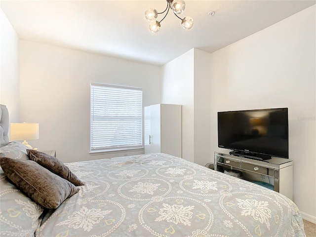 bedroom with an inviting chandelier