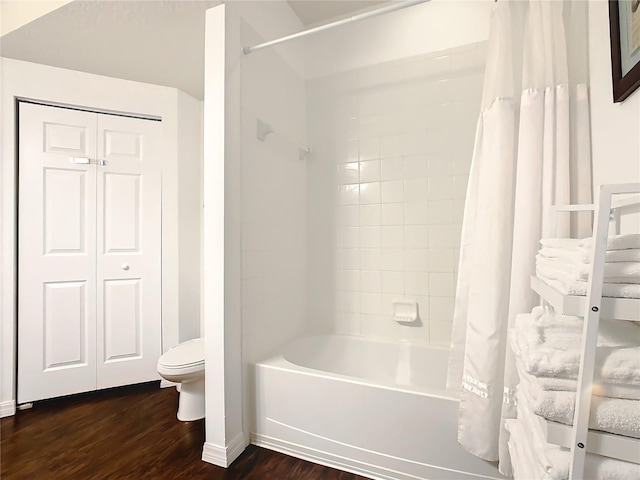 bathroom with toilet, shower / tub combo with curtain, and hardwood / wood-style floors