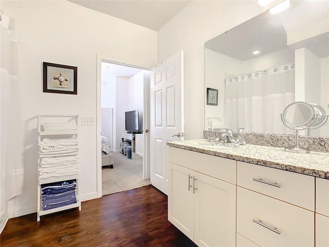 bathroom featuring vanity and wood-type flooring