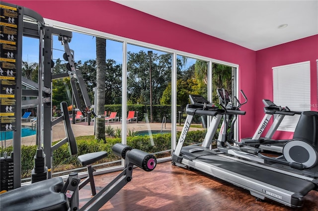 gym with dark wood-type flooring