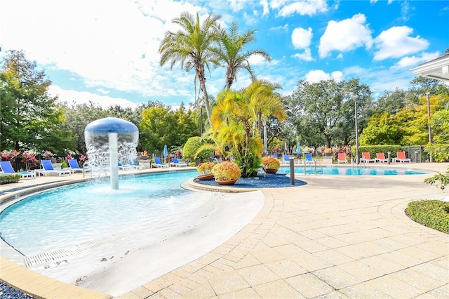 view of swimming pool with a patio area and pool water feature