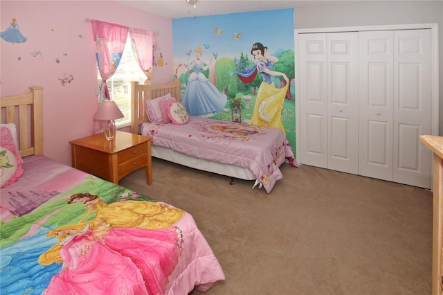 bedroom featuring carpet and a closet