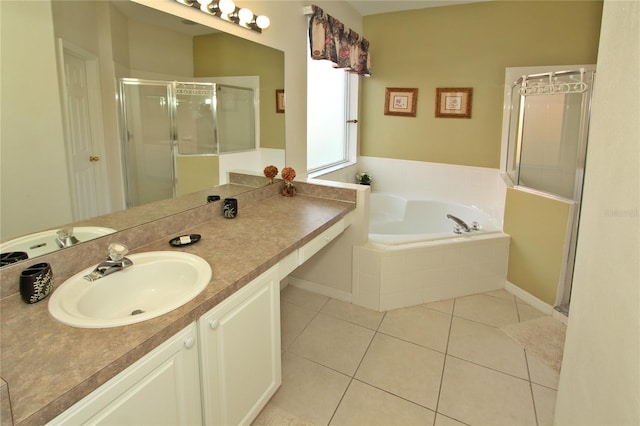 bathroom featuring tile patterned floors, vanity, and independent shower and bath