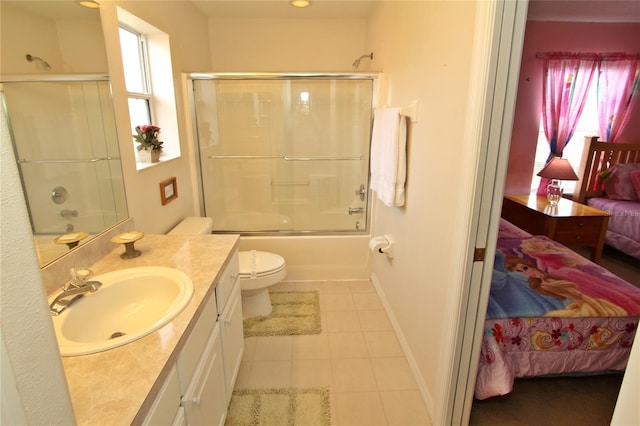 full bathroom with toilet, vanity, tile patterned floors, and shower / bath combination with glass door