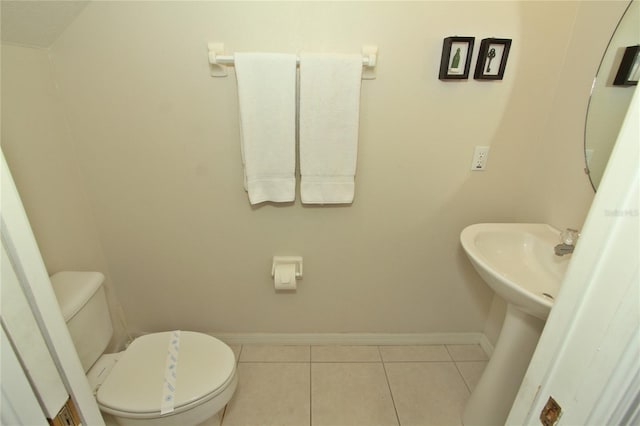 bathroom featuring tile patterned floors and toilet