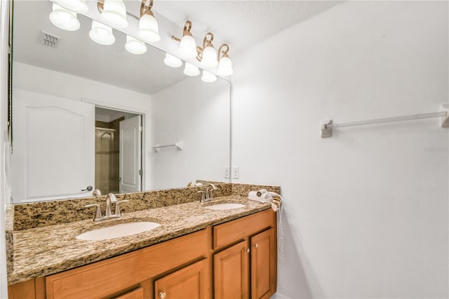 bathroom featuring dual sinks and large vanity