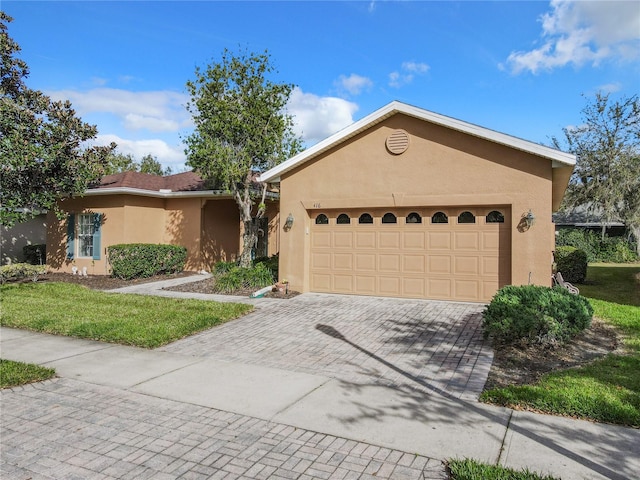 single story home with a garage