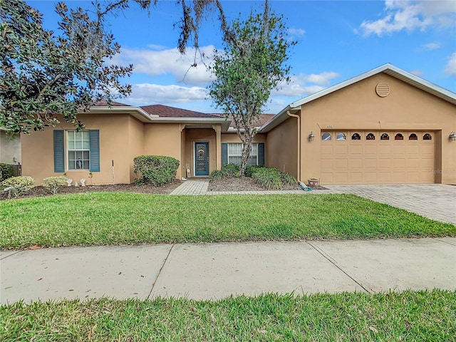 ranch-style house with a front yard and a garage