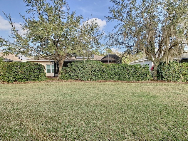 view of yard featuring a lanai