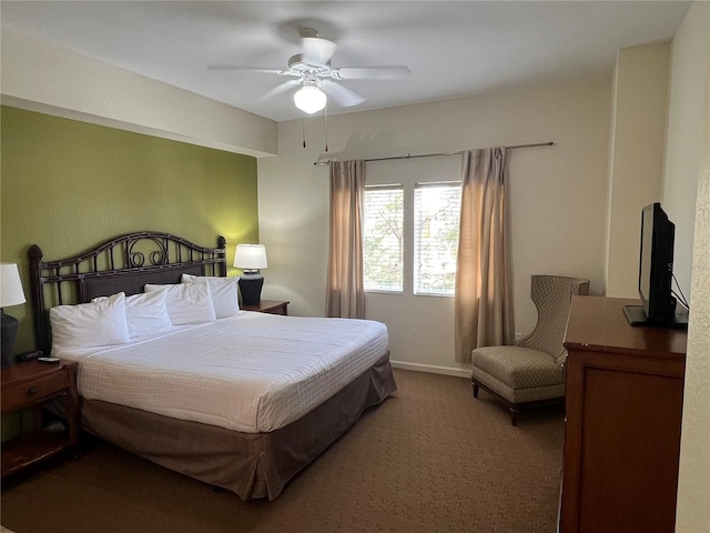 bedroom featuring dark carpet and ceiling fan