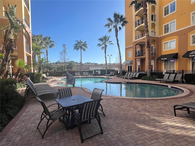 view of swimming pool featuring a patio area