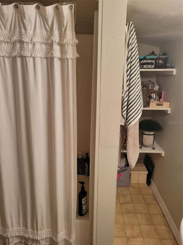 bathroom featuring tile flooring