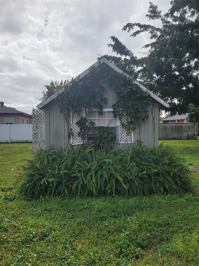 view of home's exterior with a yard