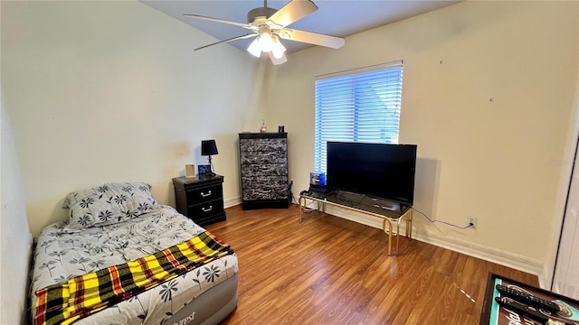 bedroom featuring ceiling fan and hardwood / wood-style flooring