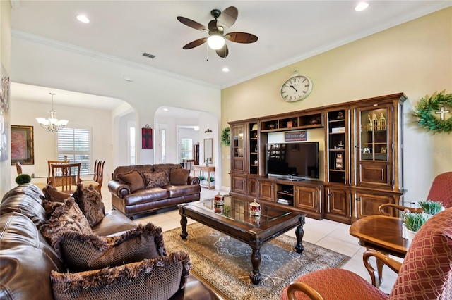 living room with light tile flooring, crown molding, and ceiling fan with notable chandelier